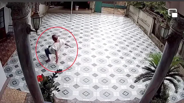 Clip: Người đàn ông đau đớn khi bị trượt ngã dưới sân lát gạch đá hoa khiến dân mạng thót tim